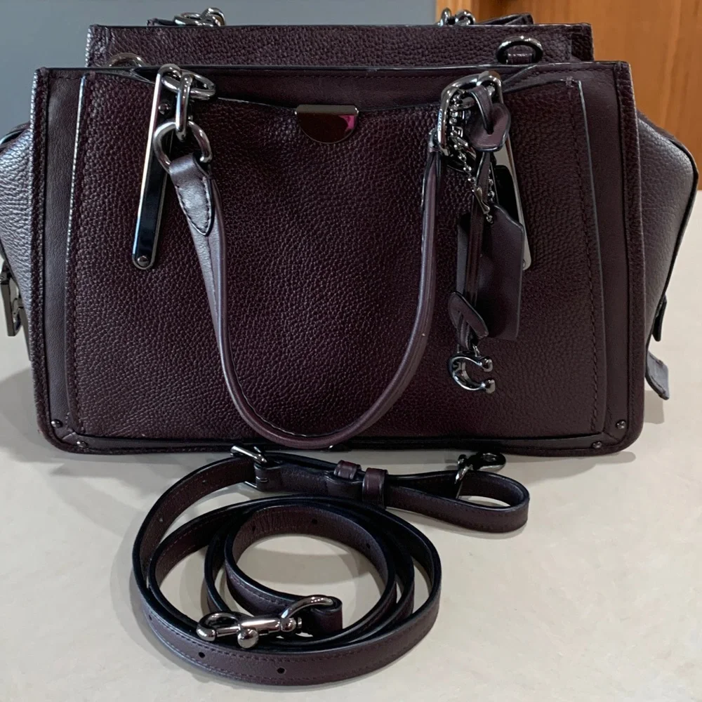 Coach Leather Handbag with shoulder straps. Plum in color